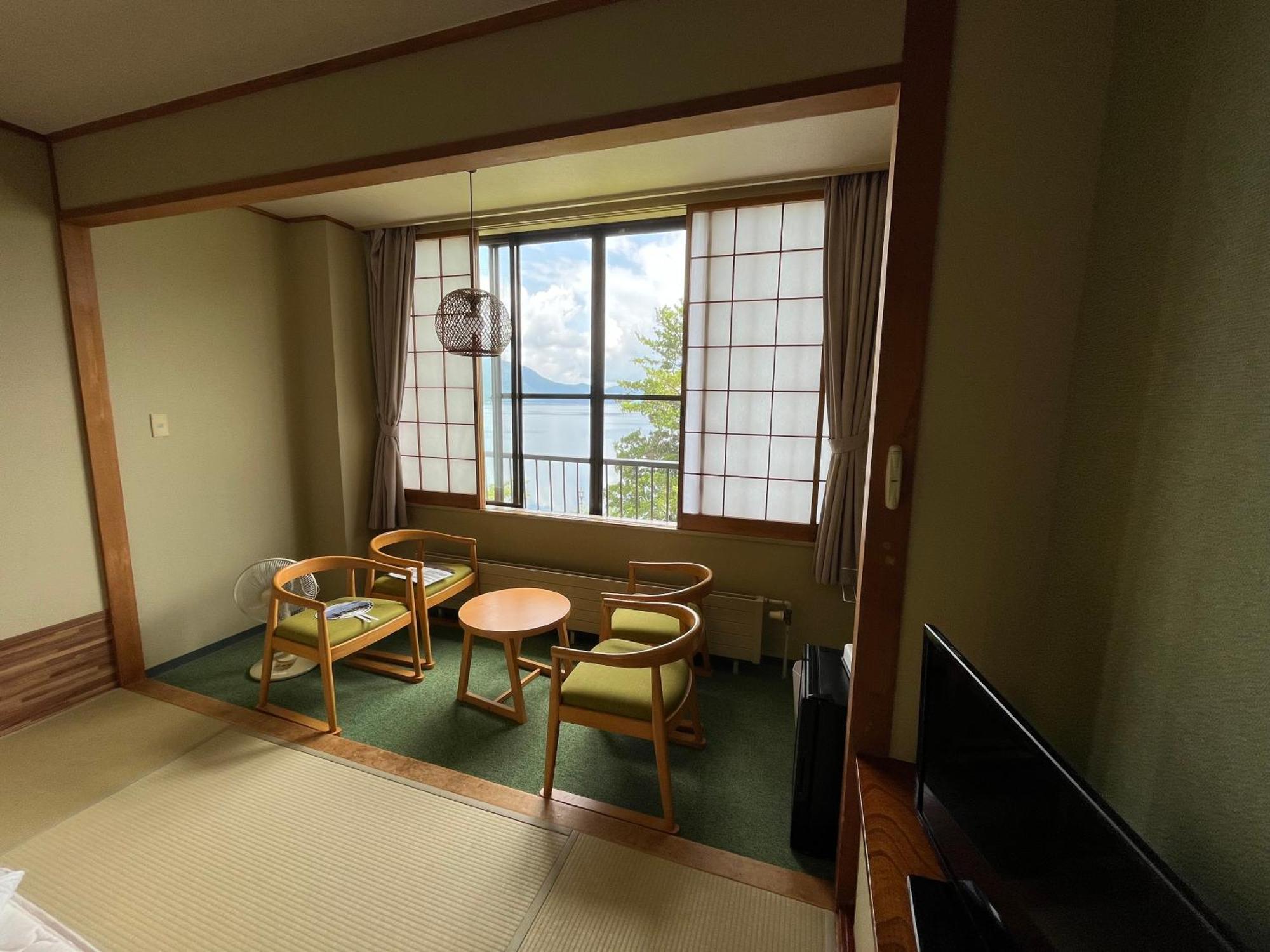 Отель Marukoma Onsen Ryokan Титосе Экстерьер фото